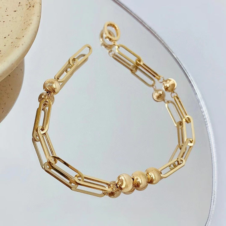 Bracciale fatto a mano con motivo a occhio di gatto in oro 18K