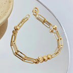 Bracciale fatto a mano con motivo a occhio di gatto in oro 18K