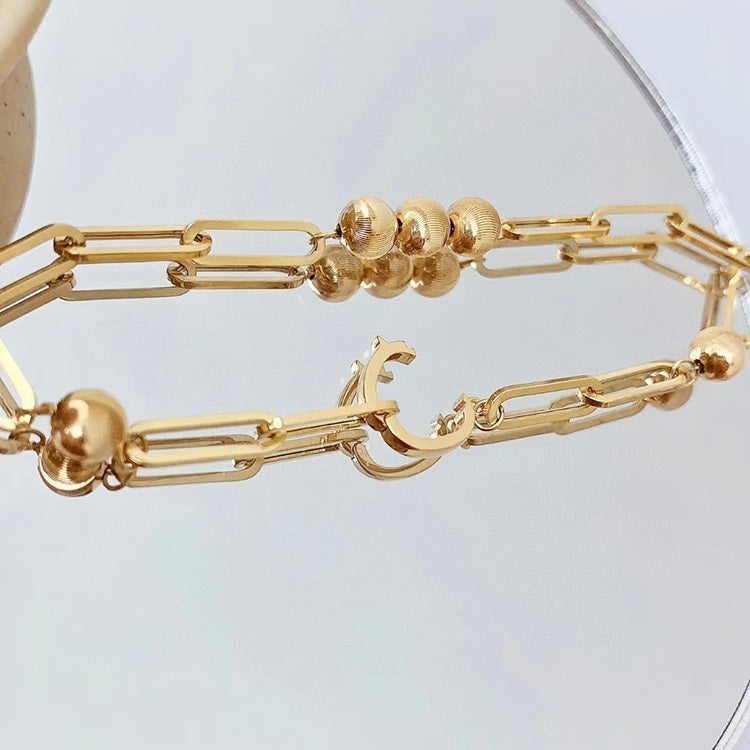 Bracciale fatto a mano con motivo a occhio di gatto in oro 18K