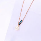 Collana Pendente Oro Rosa 14K con Perle d'Acqua Dolce e Zirconi London Blue - Eleganza Raffinata | Gioielli Perfetti - gioielliperfetti.it