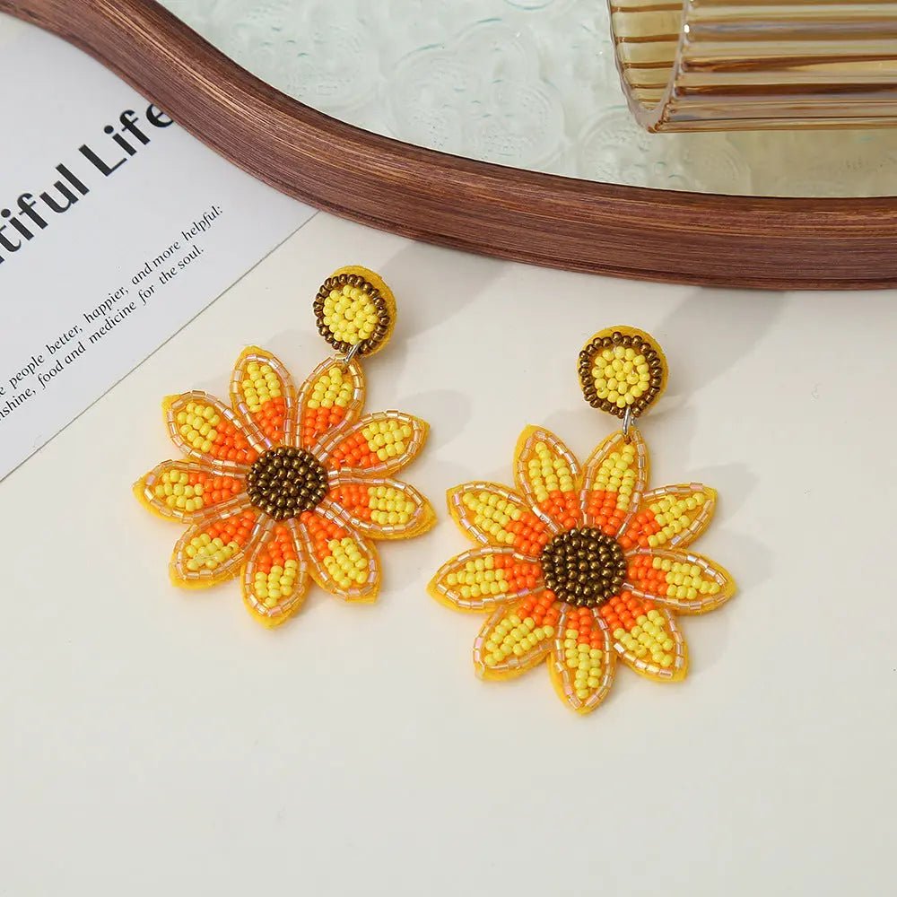 Orecchini a goccia artigianali con perline a forma di girasole giallo, arancione e marrone