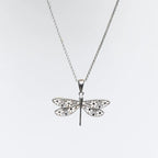 Collana MINA MINA "Gold Rush" in argento 925 rodiato con pendente libellula impreziosita da zirconi bianchi e neri.