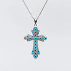 Collana MINA MINA croce media in Argento 925 rodiato, con smalto turchese e punti neri su sfondo bianco
