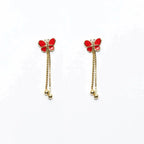 Orecchini pendenti MINA MINA con mini farfalle rosse smaltate, argento 925 placcato oro 18k e catene con sfere